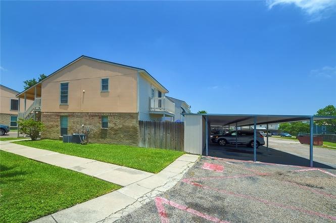 6702 Everhart Road, Unit I105 Corpus Christi, TX 78413 - Photo 18 of 19 a front view of a house with a yard