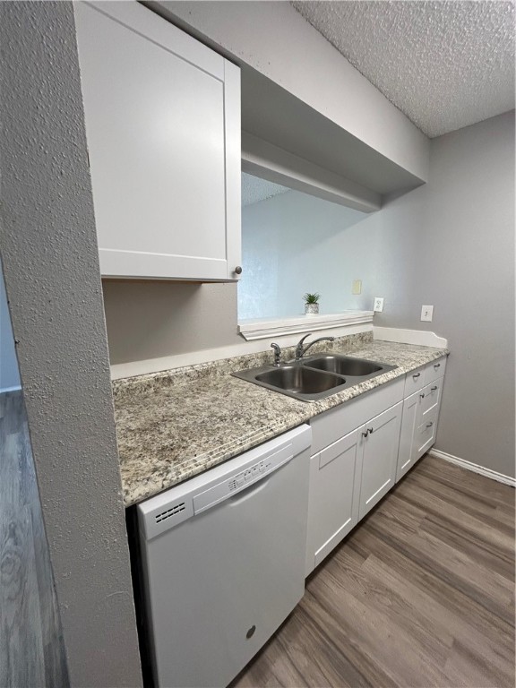 6702 Everhart Road, Unit I105 Corpus Christi, TX 78413 - Photo 6 of 19 a utility room with granite countertop cabinets washer and dryer