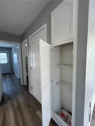a room with wooden floor and a window
