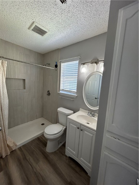 6702 Everhart Road, Unit I105 Corpus Christi, TX 78413 - Photo 9 of 19 a bathroom with a toilet sink and shower