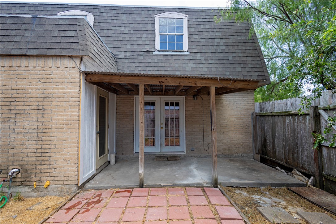 5030 Meandering Lane, Unit 5030 Corpus Christi, TX 78413 - Photo 14 of 15 a view of a brick house with a large window