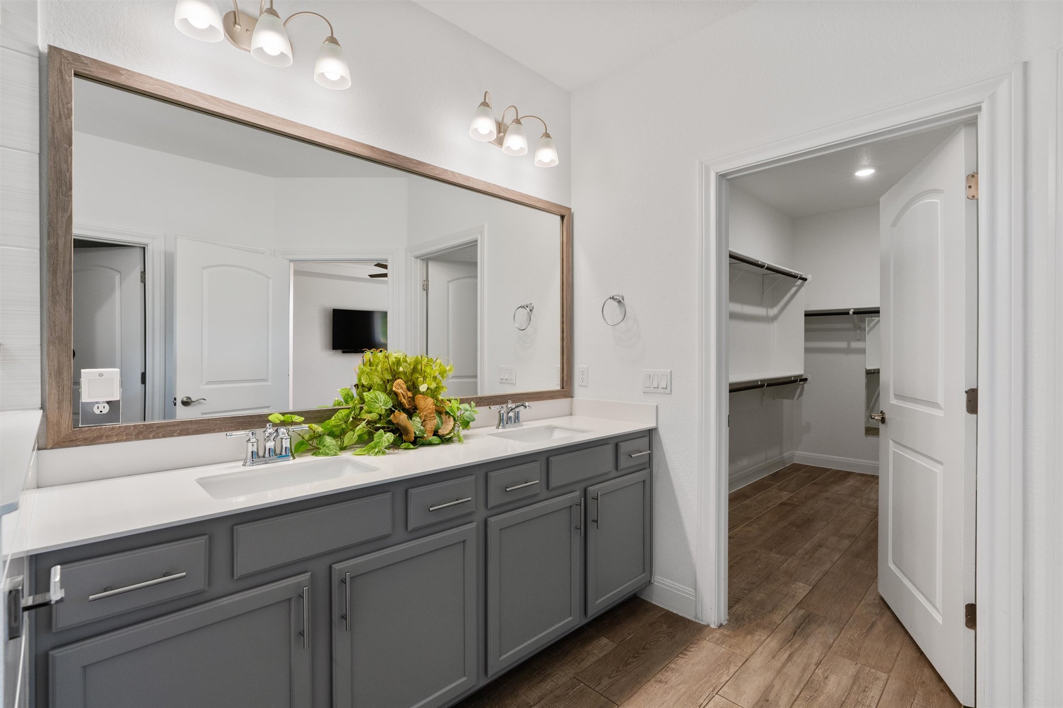 202 Spanish Star Street Georgetown, TX 78633 - Photo 21 of 32 a spacious bathroom with a granite countertop sink and a mirror