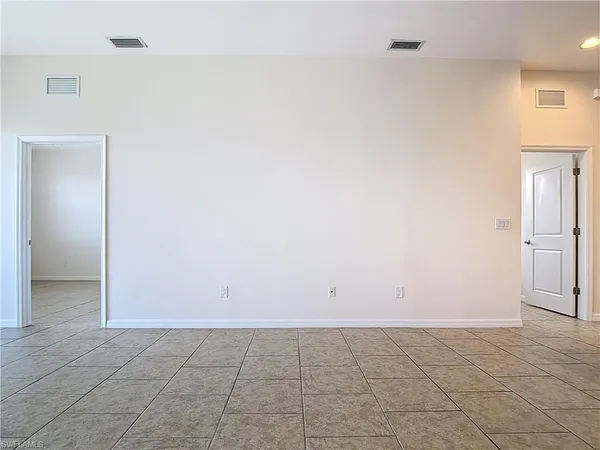 a view of a kitchen with a sink and a refrigerator