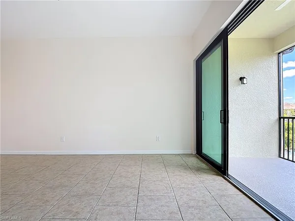 a view of a room with sliding door and mountain view