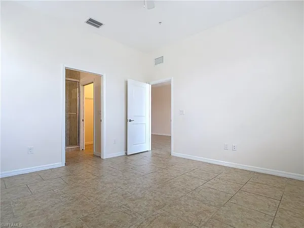 a bathroom with a glass shower door