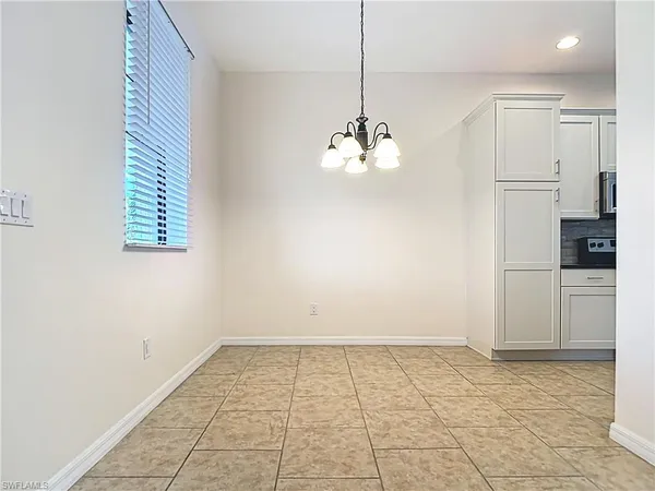 a kitchen with a sink and a stove top oven