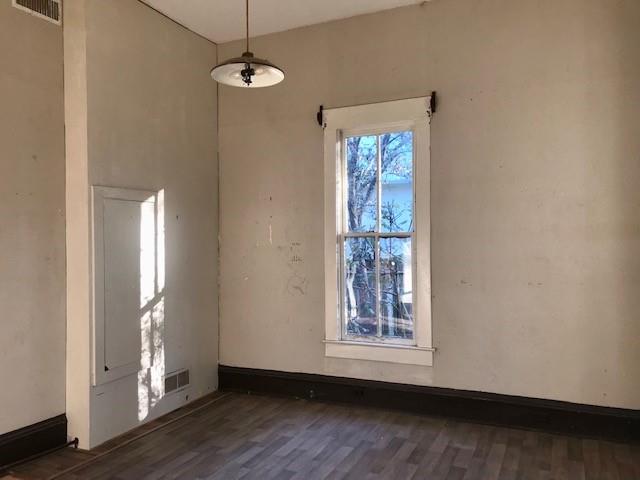 6962 Redbud Lane Ida, LA 71044 - Photo 21 of 40 a view of an empty room with wooden floor and a window