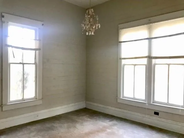 a view of room with window and ceiling fan