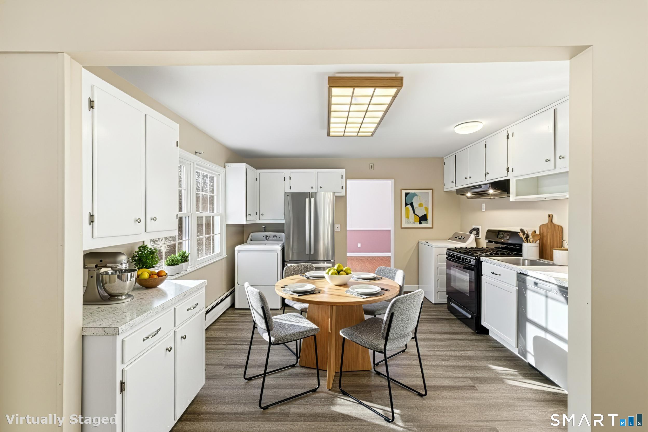 57 Hellstrom Road East Haven, CT 06512 - Photo 12 of 36 a kitchen with stainless steel appliances kitchen island granite countertop a sink and cabinets