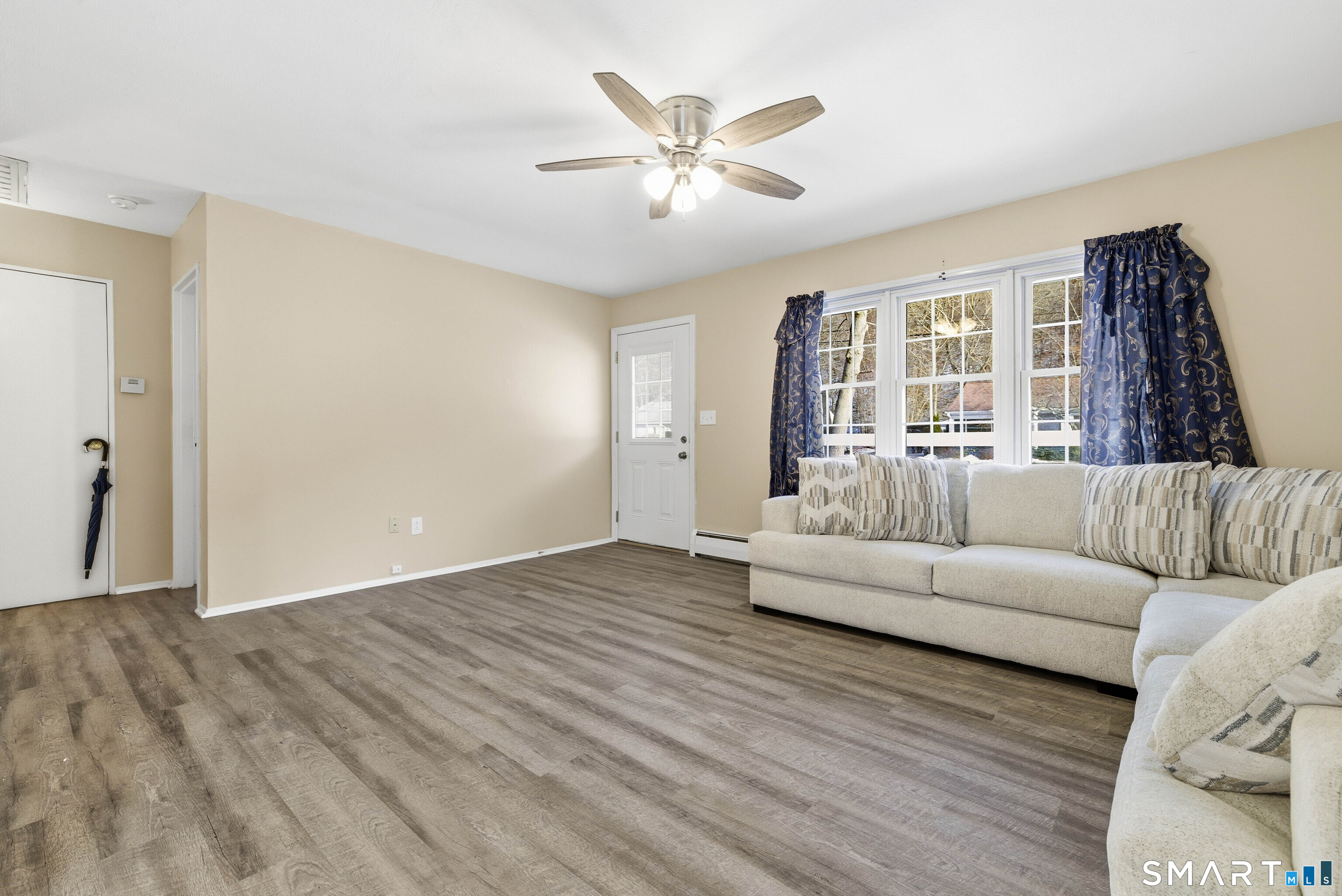 57 Hellstrom Road East Haven, CT 06512 - Photo 13 of 36 a living room with furniture and a large window