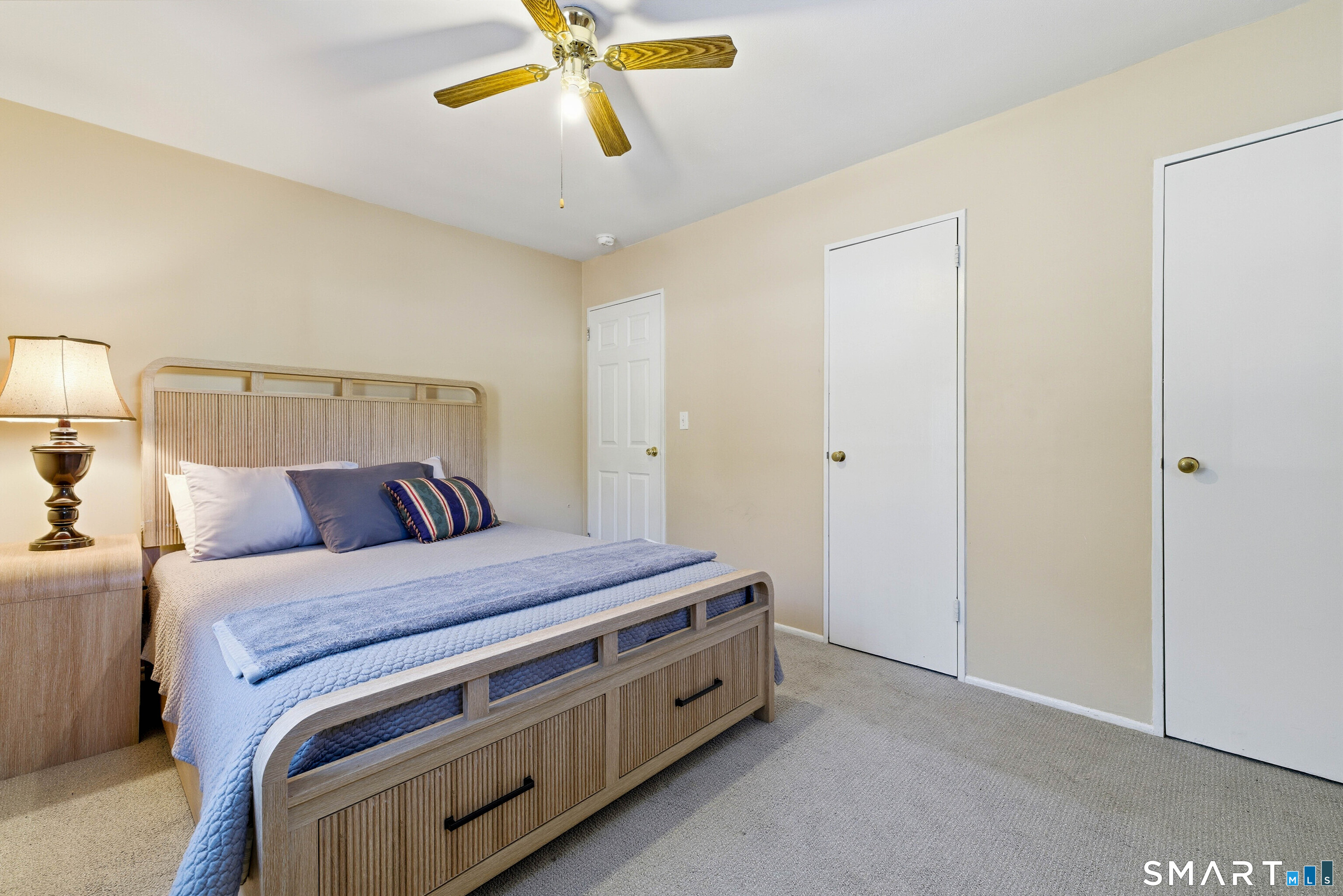 57 Hellstrom Road East Haven, CT 06512 - Photo 15 of 36 a room with a bed and a chandelier