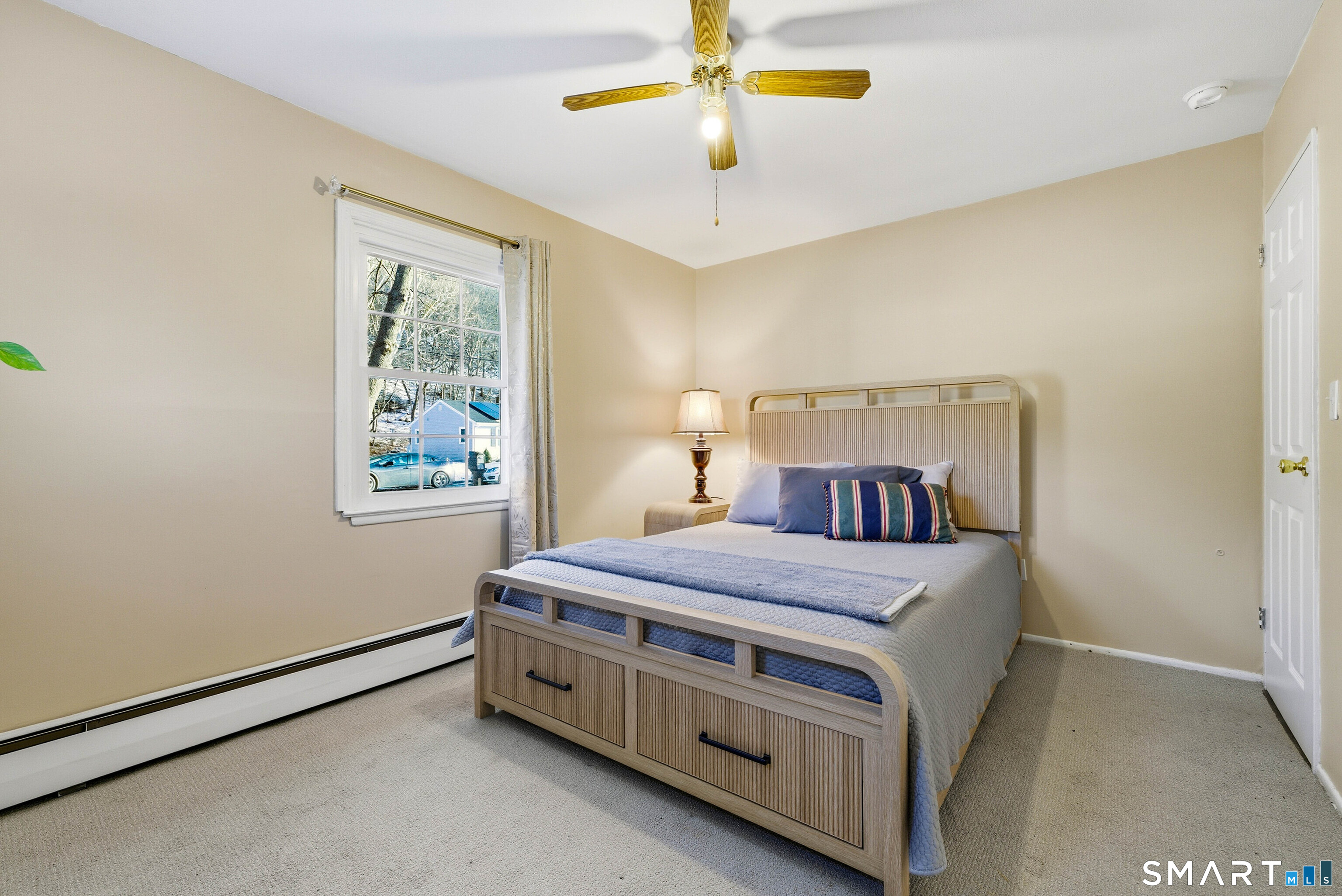 57 Hellstrom Road East Haven, CT 06512 - Photo 16 of 36 a bedroom with a bed and a window