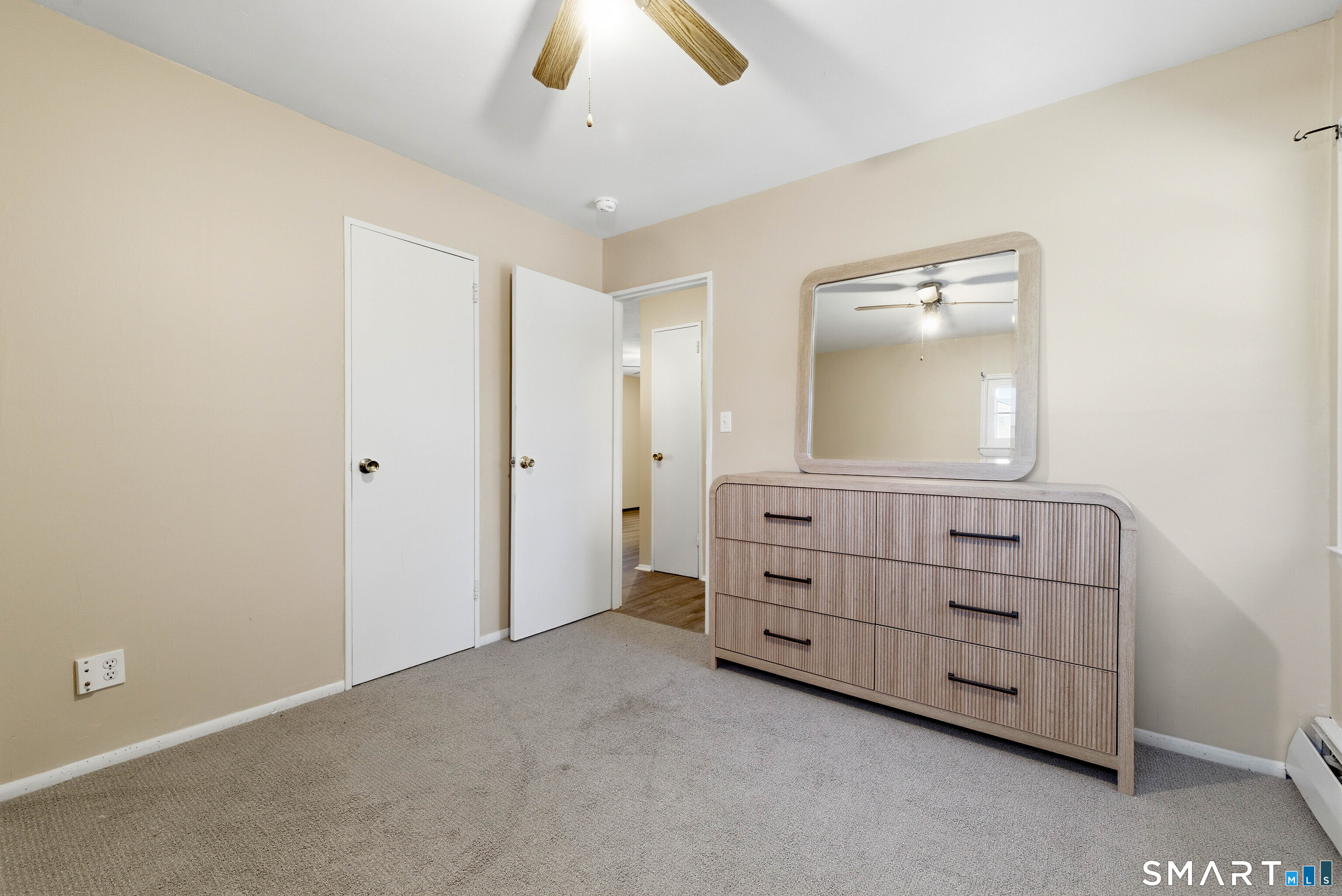 57 Hellstrom Road East Haven, CT 06512 - Photo 18 of 36 an empty room with windows and cabinet