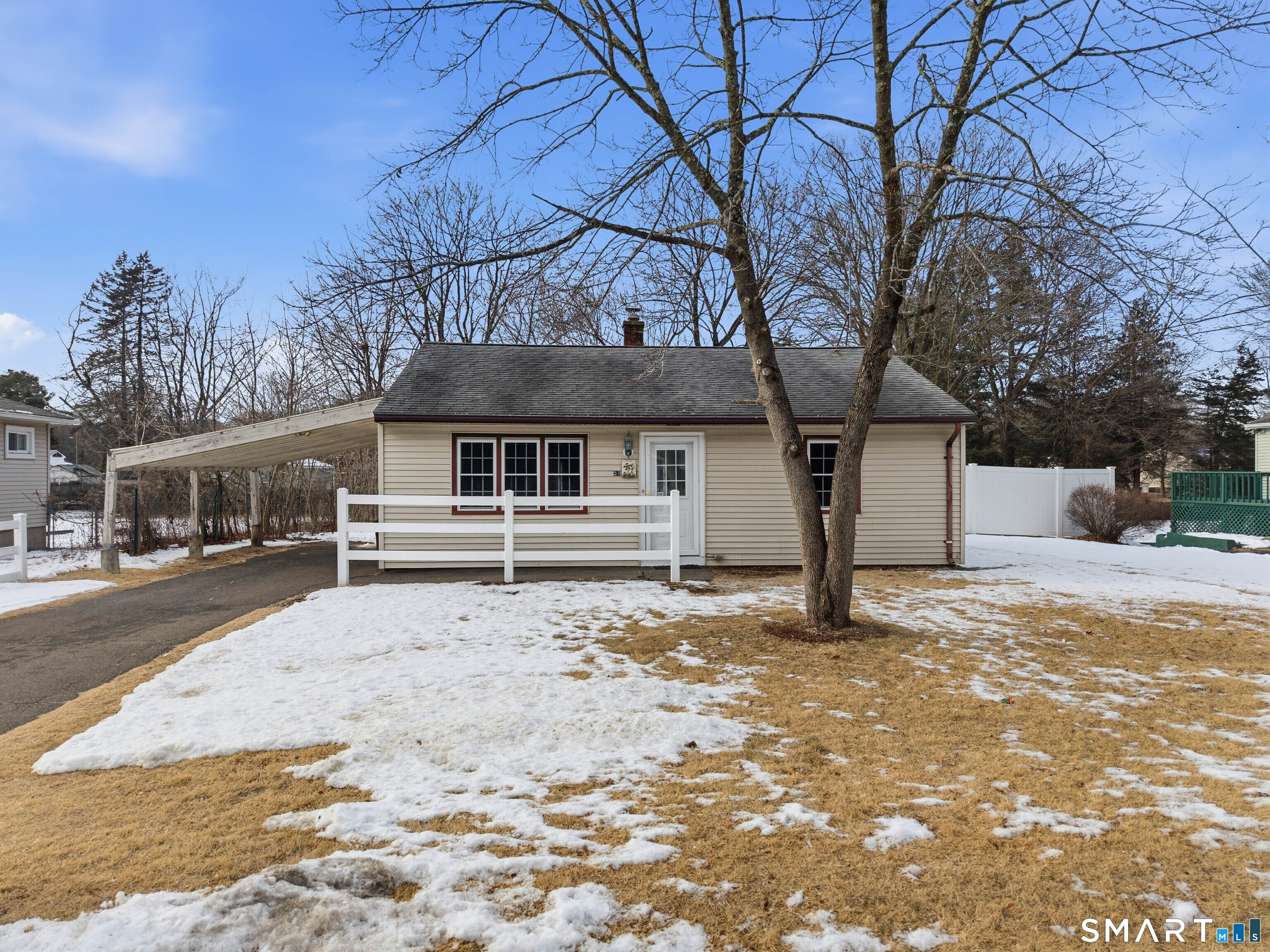 57 Hellstrom Road East Haven, CT 06512 - Photo 2 of 36 a front view of a house with a yard covered in snow