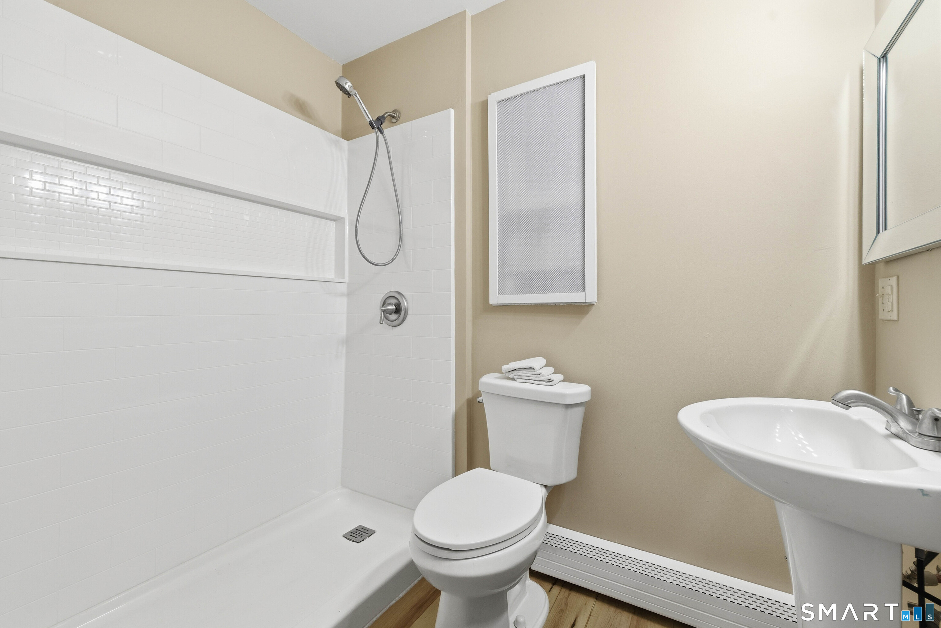 57 Hellstrom Road East Haven, CT 06512 - Photo 21 of 36 a bathroom with a toilet sink and shower