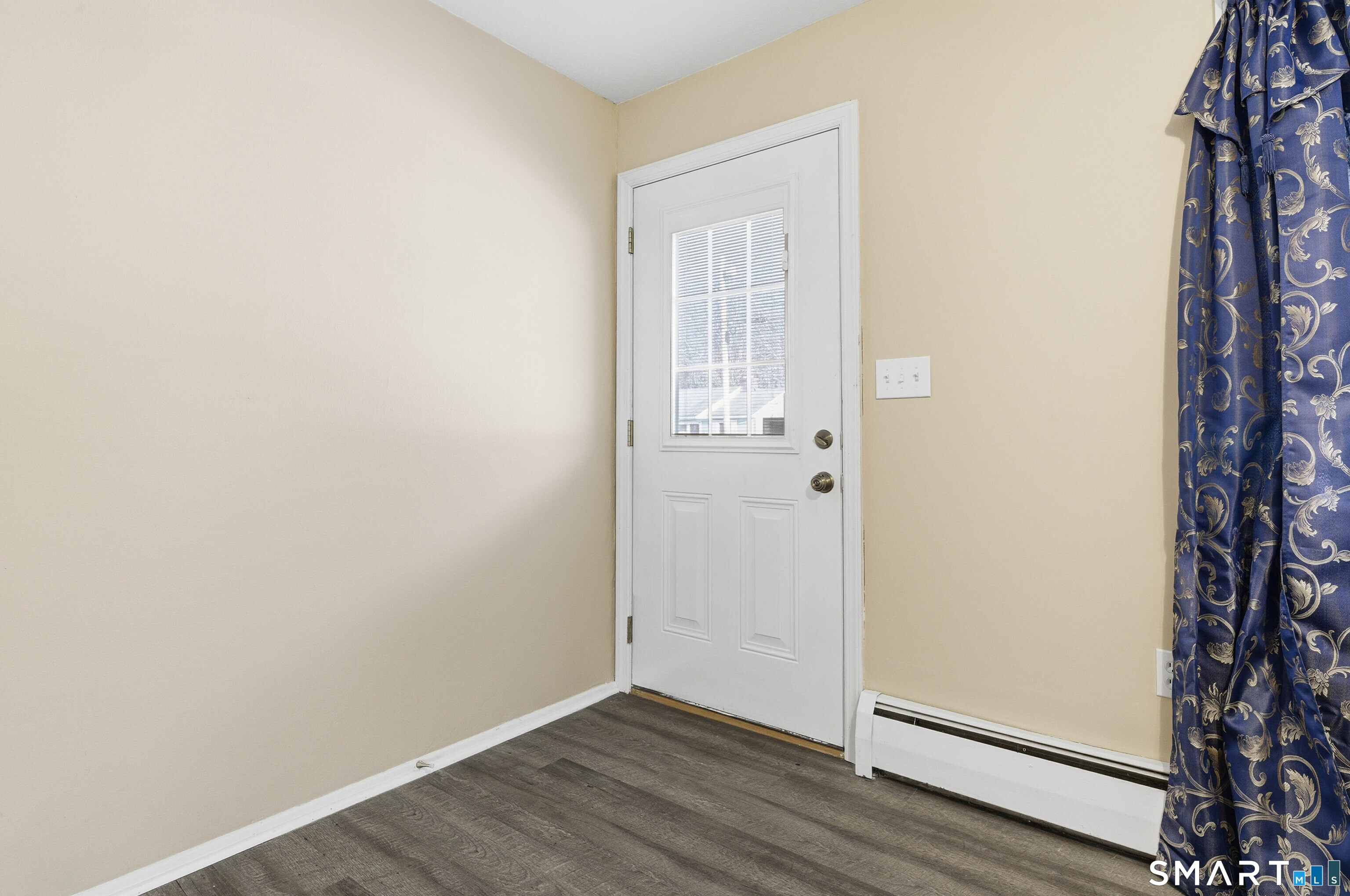 57 Hellstrom Road East Haven, CT 06512 - Photo 5 of 36 an empty room with wooden floor and closet