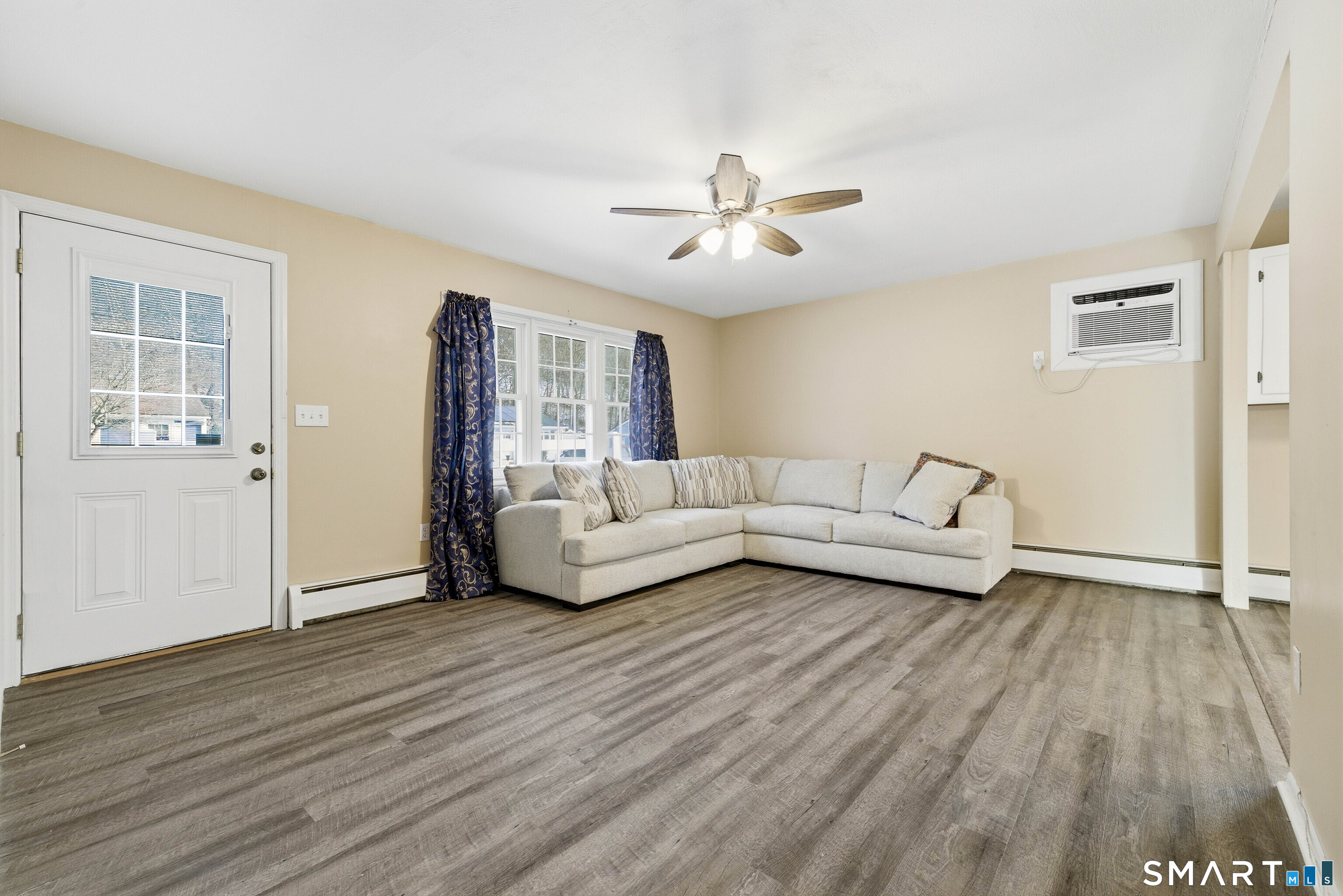 57 Hellstrom Road East Haven, CT 06512 - Photo 6 of 36 a living room with furniture and wooden floor