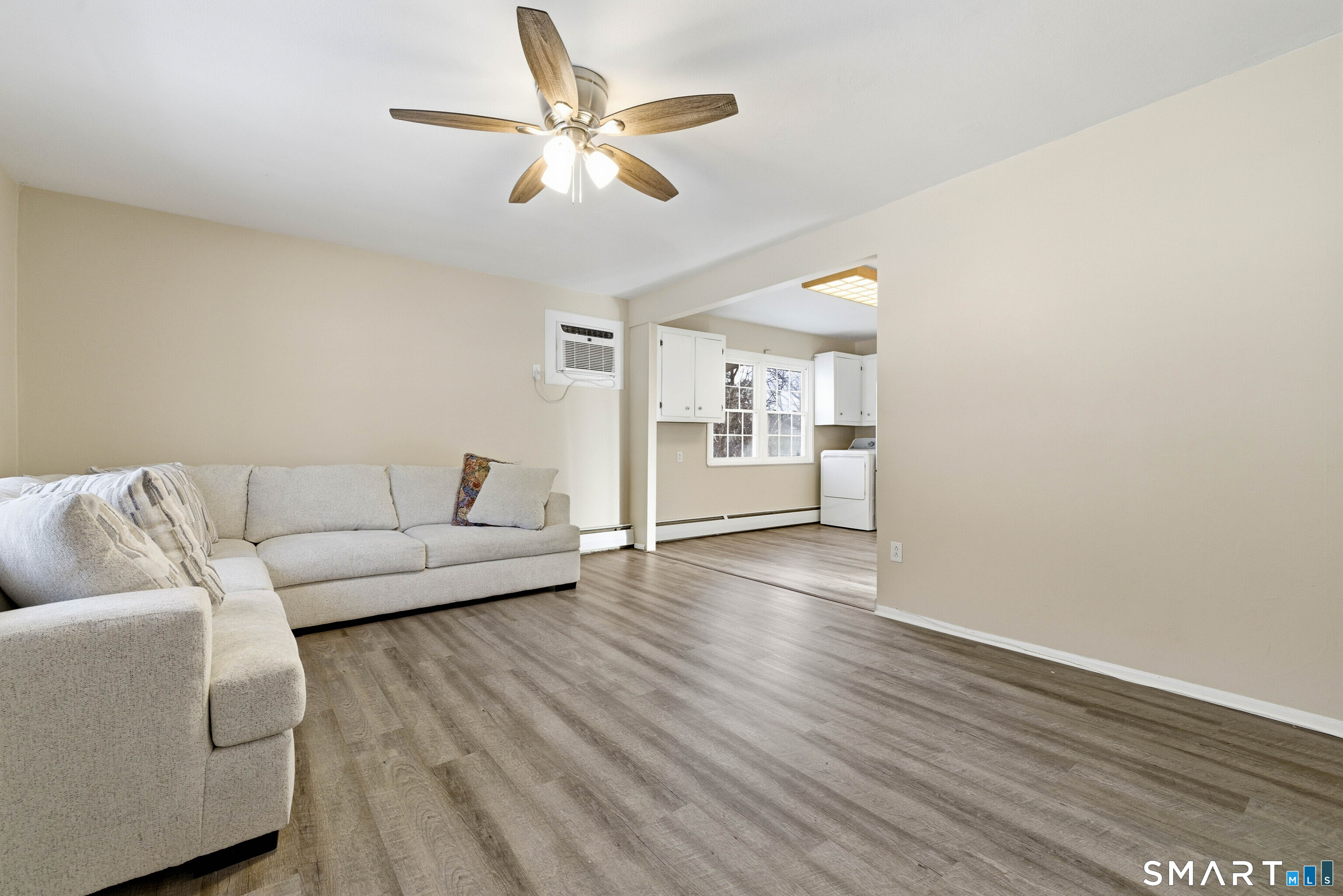57 Hellstrom Road East Haven, CT 06512 - Photo 7 of 36 a living room with furniture and a wooden floor