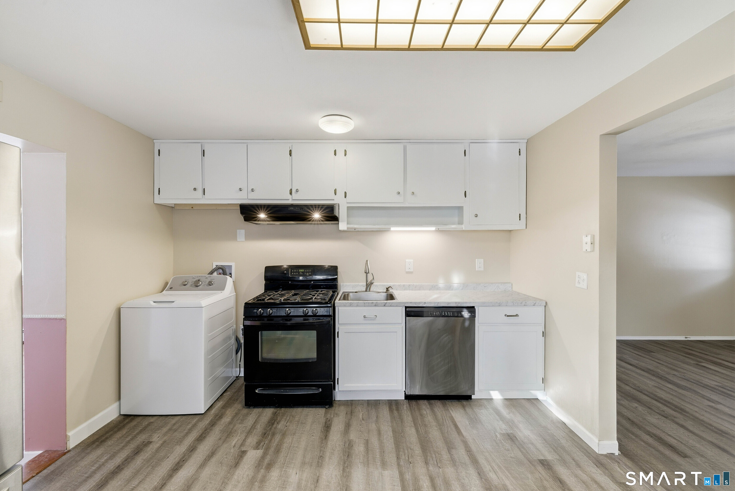 57 Hellstrom Road East Haven, CT 06512 - Photo 10 of 36 a kitchen with stainless steel appliances granite countertop a stove and a refrigerator