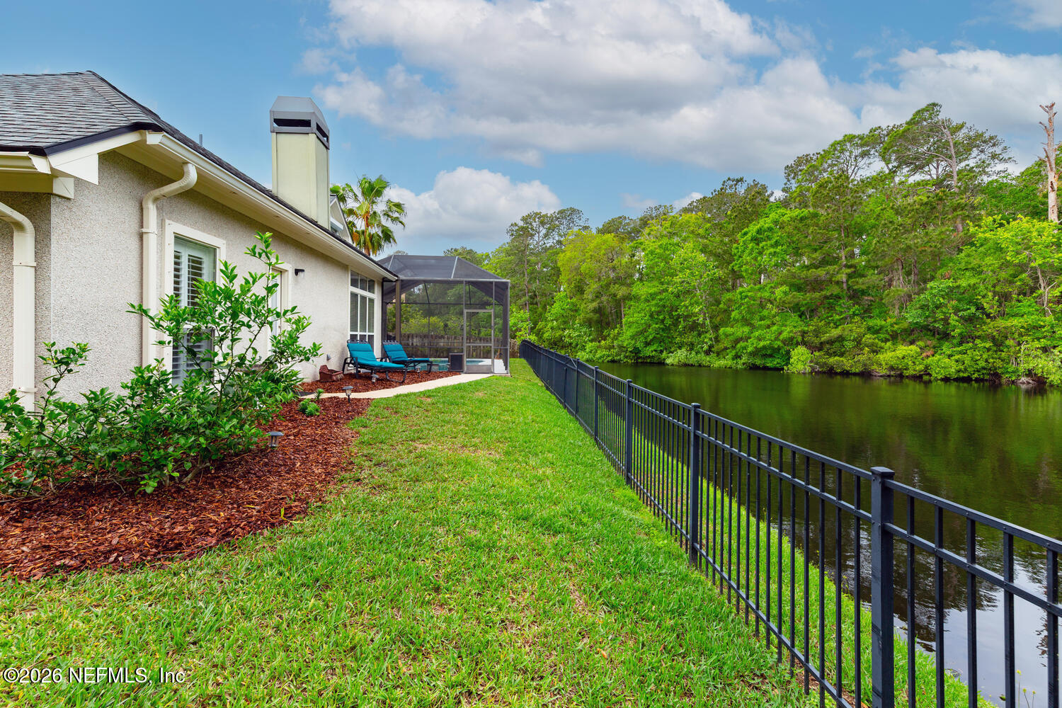 240 Shell Bluff Court Ponte Vedra Beach, FL 32082 - Photo 13 of 53 a view of a garden with a lake