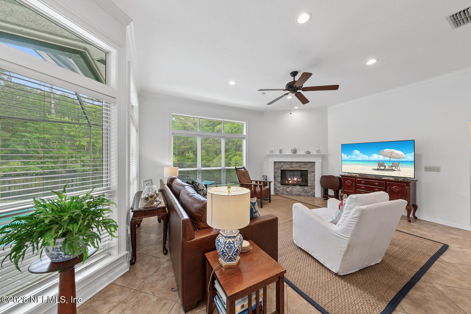 240 Shell Bluff Court Ponte Vedra Beach, FL 32082 - Photo 25 of 53 a living room with furniture a fireplace and a potted plant