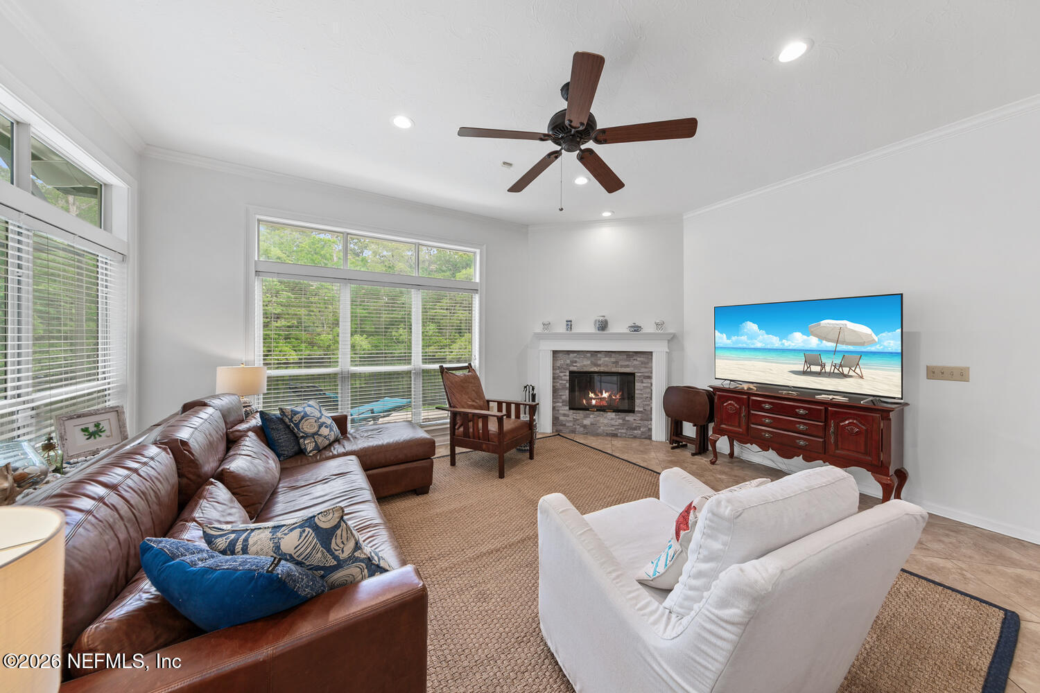 240 Shell Bluff Court Ponte Vedra Beach, FL 32082 - Photo 26 of 53 a living room with furniture a fireplace and a flat screen tv