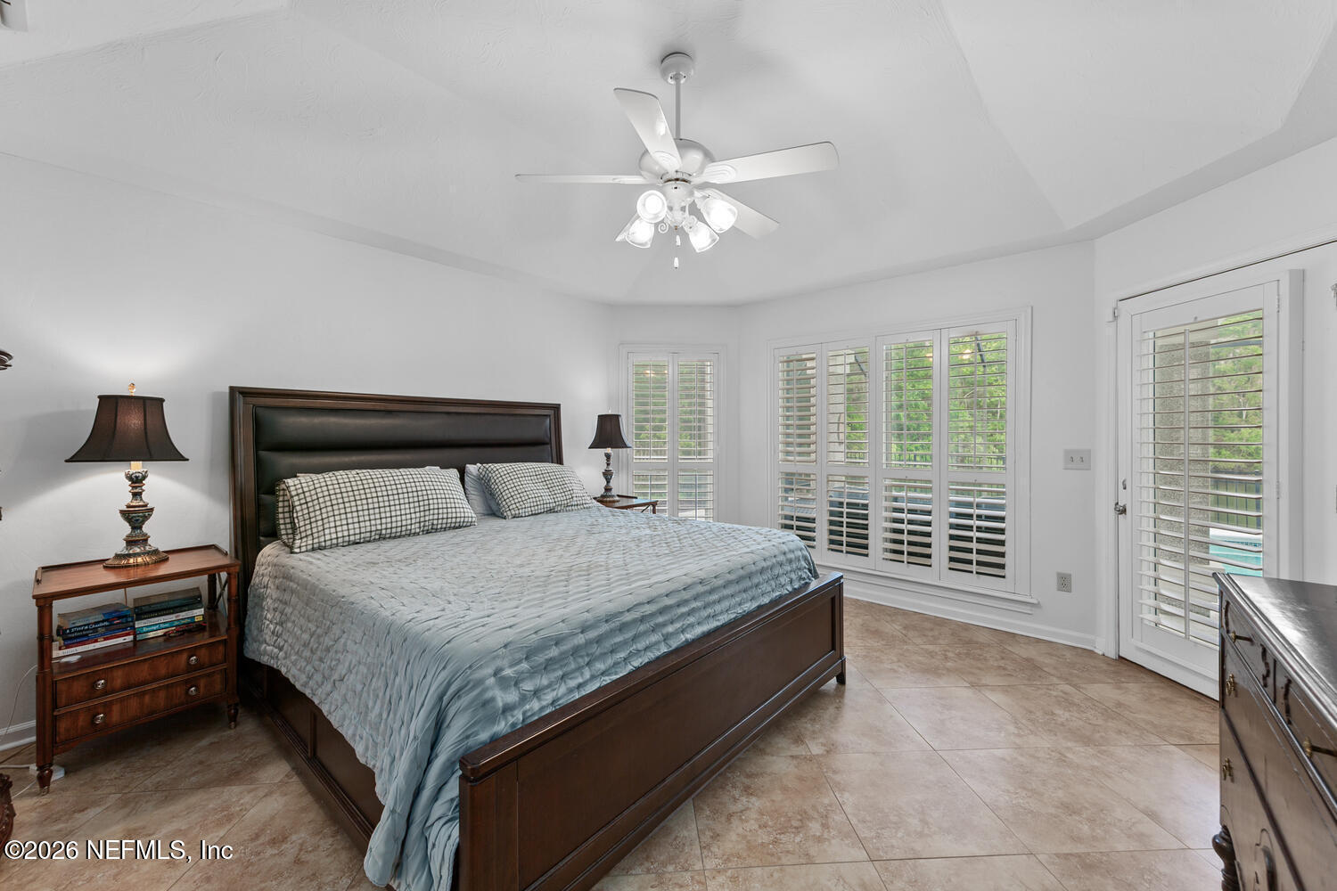 240 Shell Bluff Court Ponte Vedra Beach, FL 32082 - Photo 28 of 53 a bedroom with a large bed and a chandelier fan