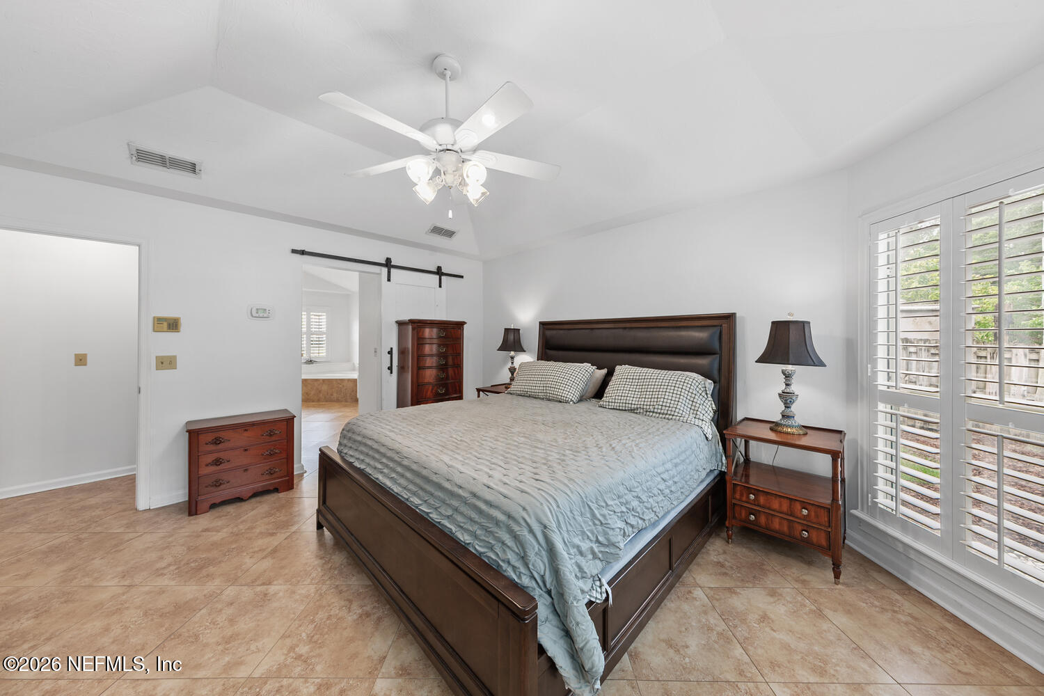 240 Shell Bluff Court Ponte Vedra Beach, FL 32082 - Photo 29 of 53 a spacious bedroom with a bed and a chandelier