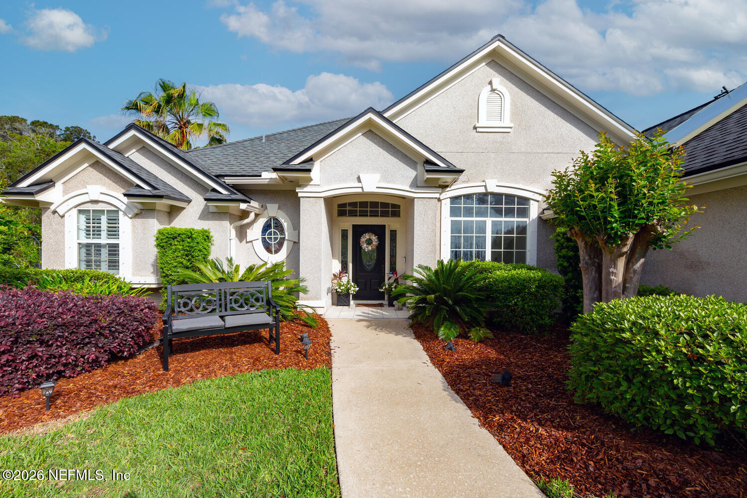 240 Shell Bluff Court Ponte Vedra Beach, FL 32082 - Photo 3 of 53 a front view of a house with porch and garden