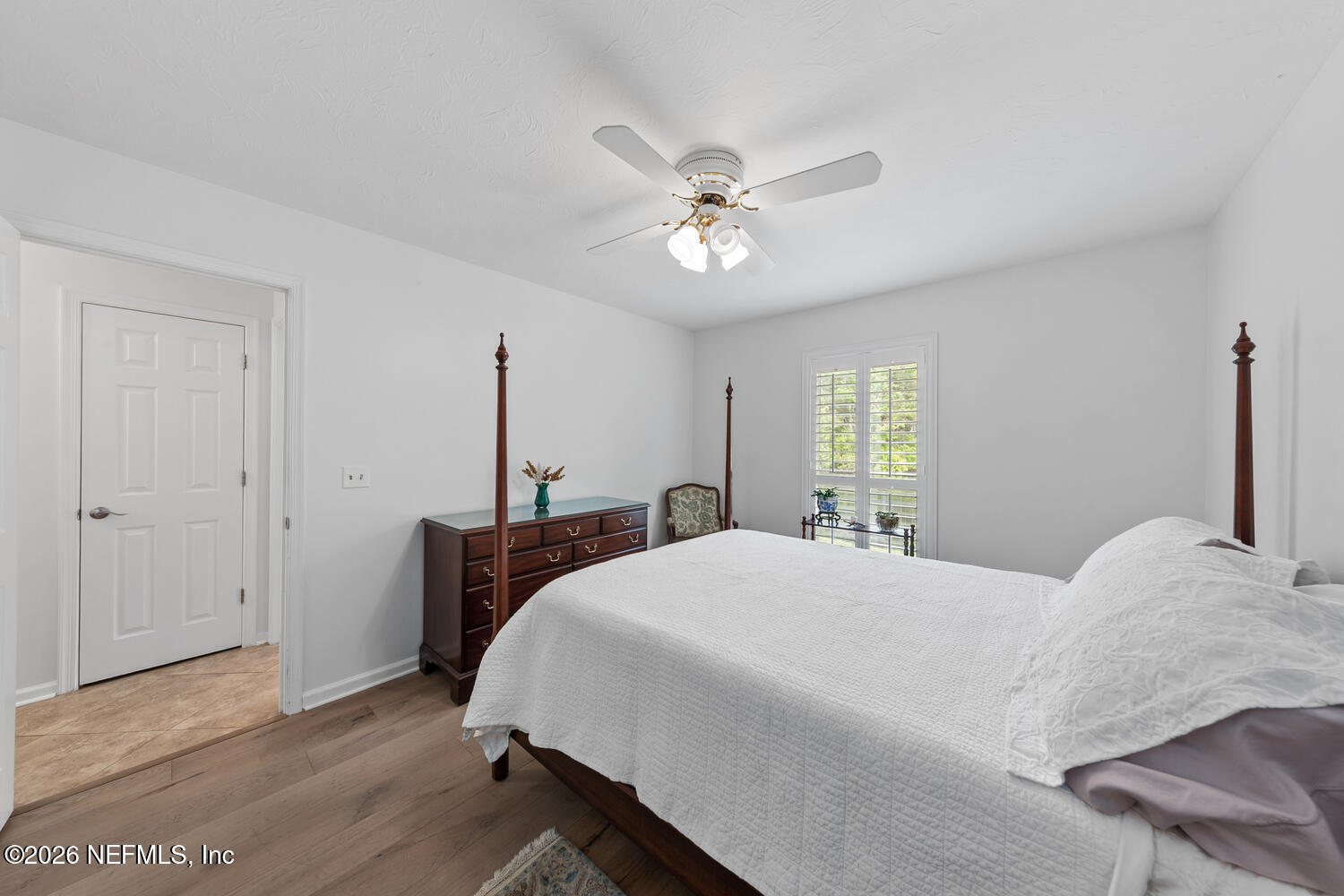 240 Shell Bluff Court Ponte Vedra Beach, FL 32082 - Photo 40 of 53 a bedroom with a bed chandelier and a window
