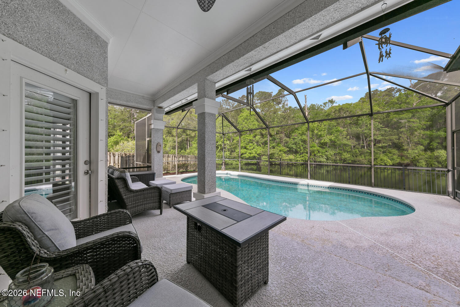 240 Shell Bluff Court Ponte Vedra Beach, FL 32082 - Photo 9 of 53 a living room with furniture and a floor to ceiling window