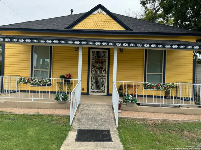 a view of house with a outdoor seating