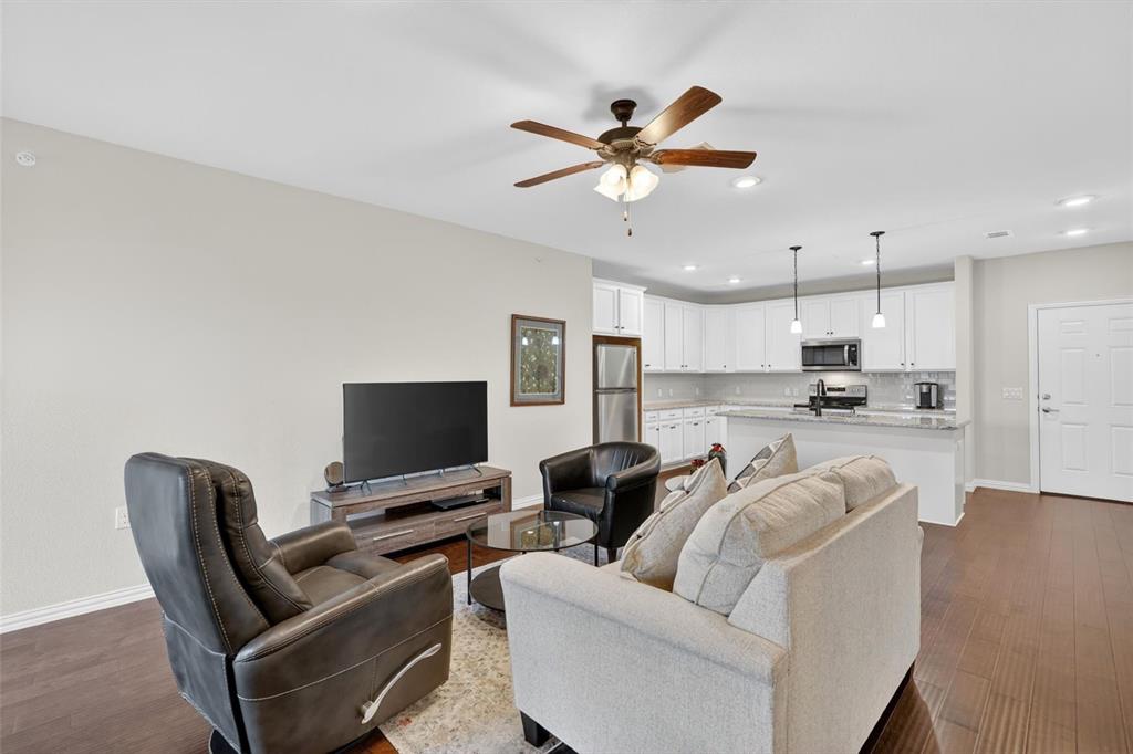 651 Watters Road, Unit 5305 Allen, TX 75013 - Photo 4 of 40 a living room with furniture and a flat screen tv