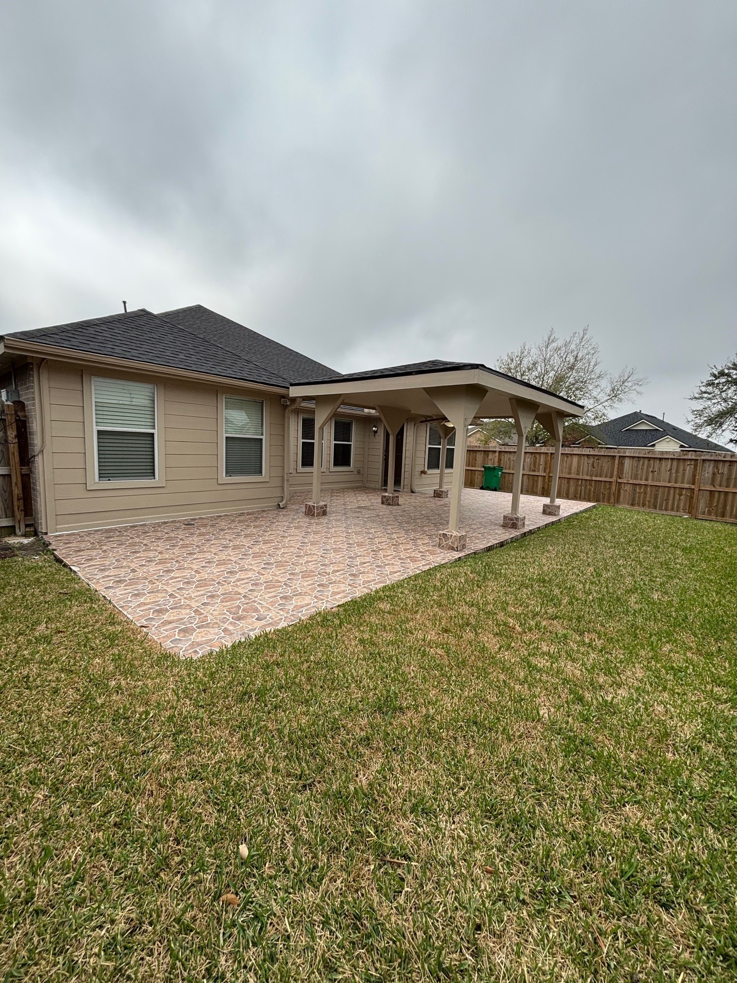 903 Christopher Baytown, TX 77521 - Photo 18 of 19 a front view of house with yard and trees in the background