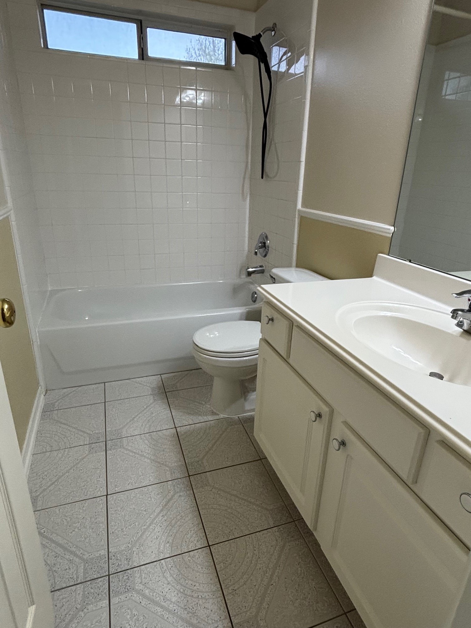 903 Christopher Baytown, TX 77521 - Photo 20 of 22 Bright and functional hall bathroom featuring a full bathtub and modern fixtures, perfect for guests and family alike.