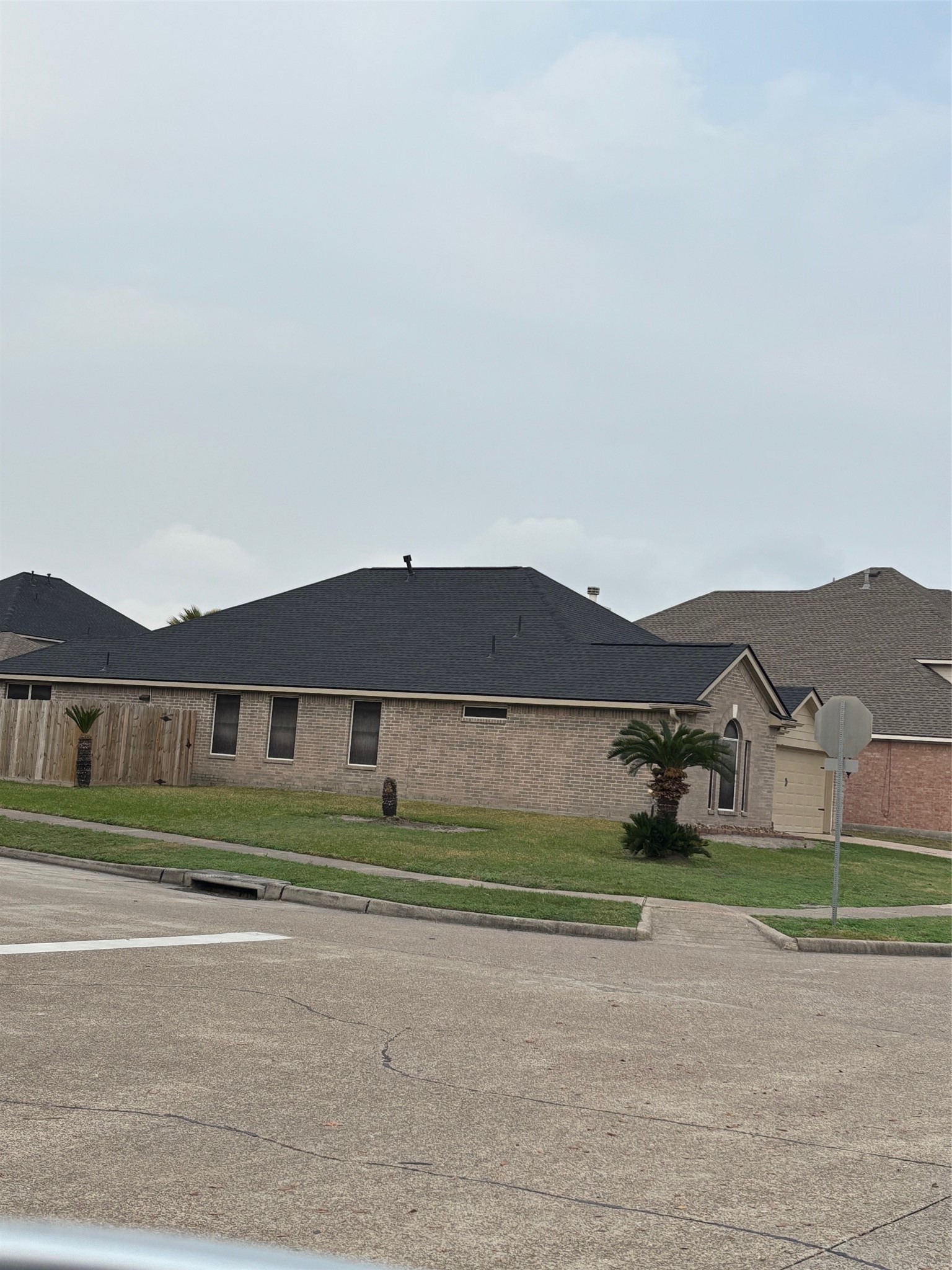 903 Christopher Baytown, TX 77521 - Photo 2 of 19 a front view of a house with a yard and garage
