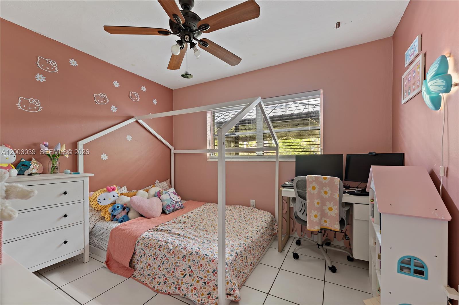 3921 Southwest 124th Court Miami, FL 33175 - Photo 14 of 22 a bedroom with a bed and a chandelier