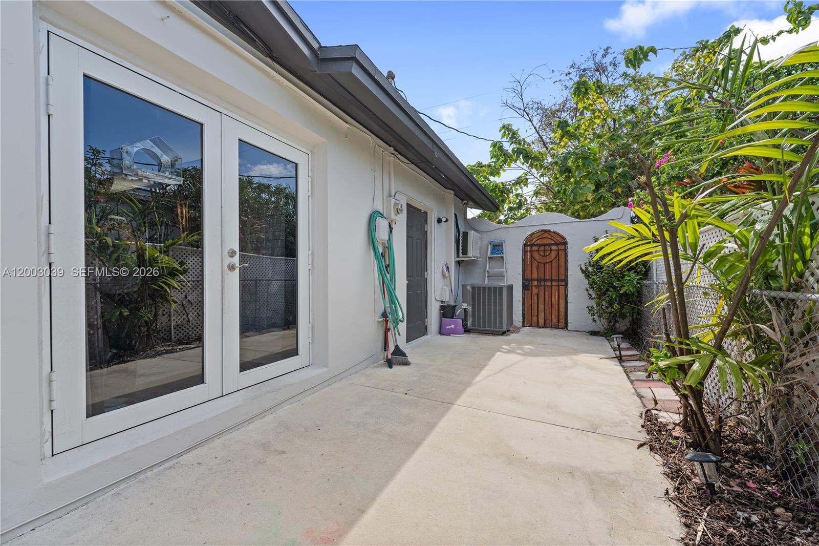 3921 Southwest 124th Court Miami, FL 33175 - Photo 18 of 22 a couple of potted plants in front of door