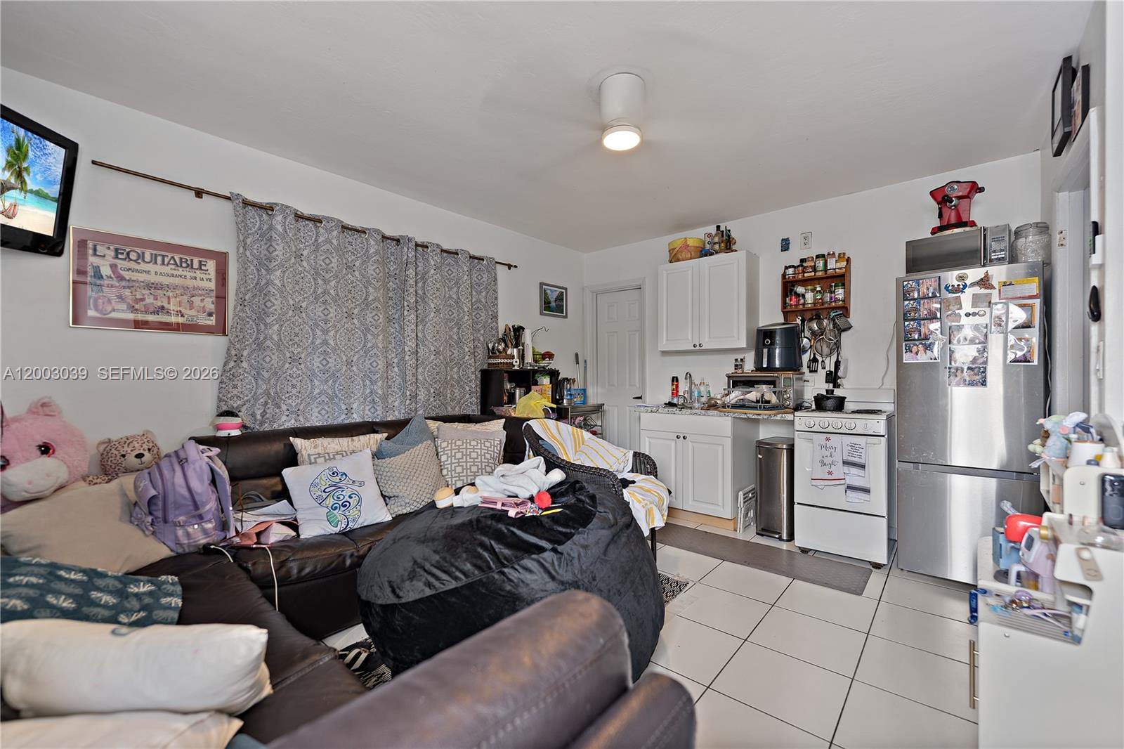 3921 Southwest 124th Court Miami, FL 33175 - Photo 20 of 22 a living room with furniture and a flat screen tv