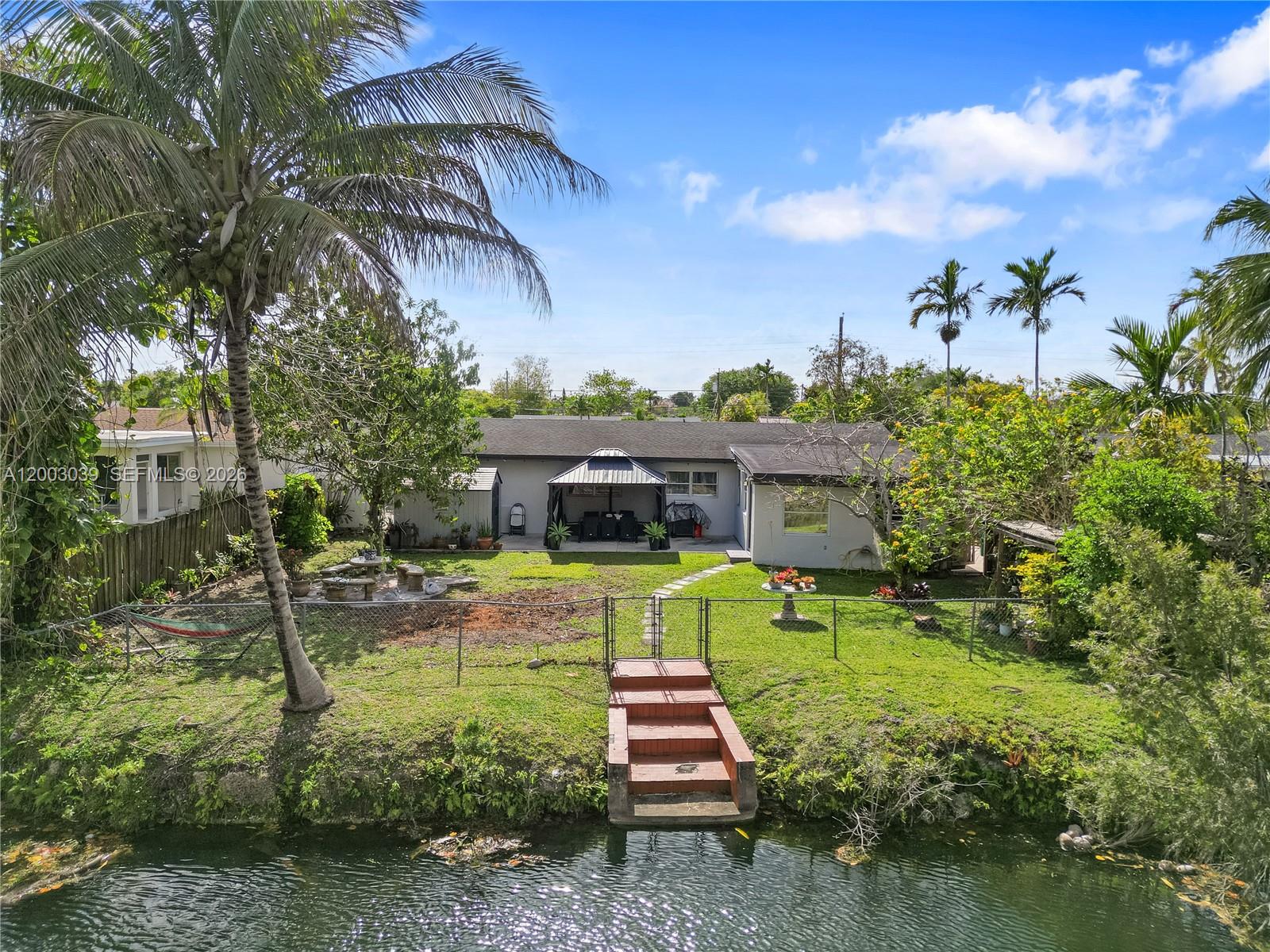 3921 Southwest 124th Court Miami, FL 33175 - Photo 3 of 22 a front view of a house with garden