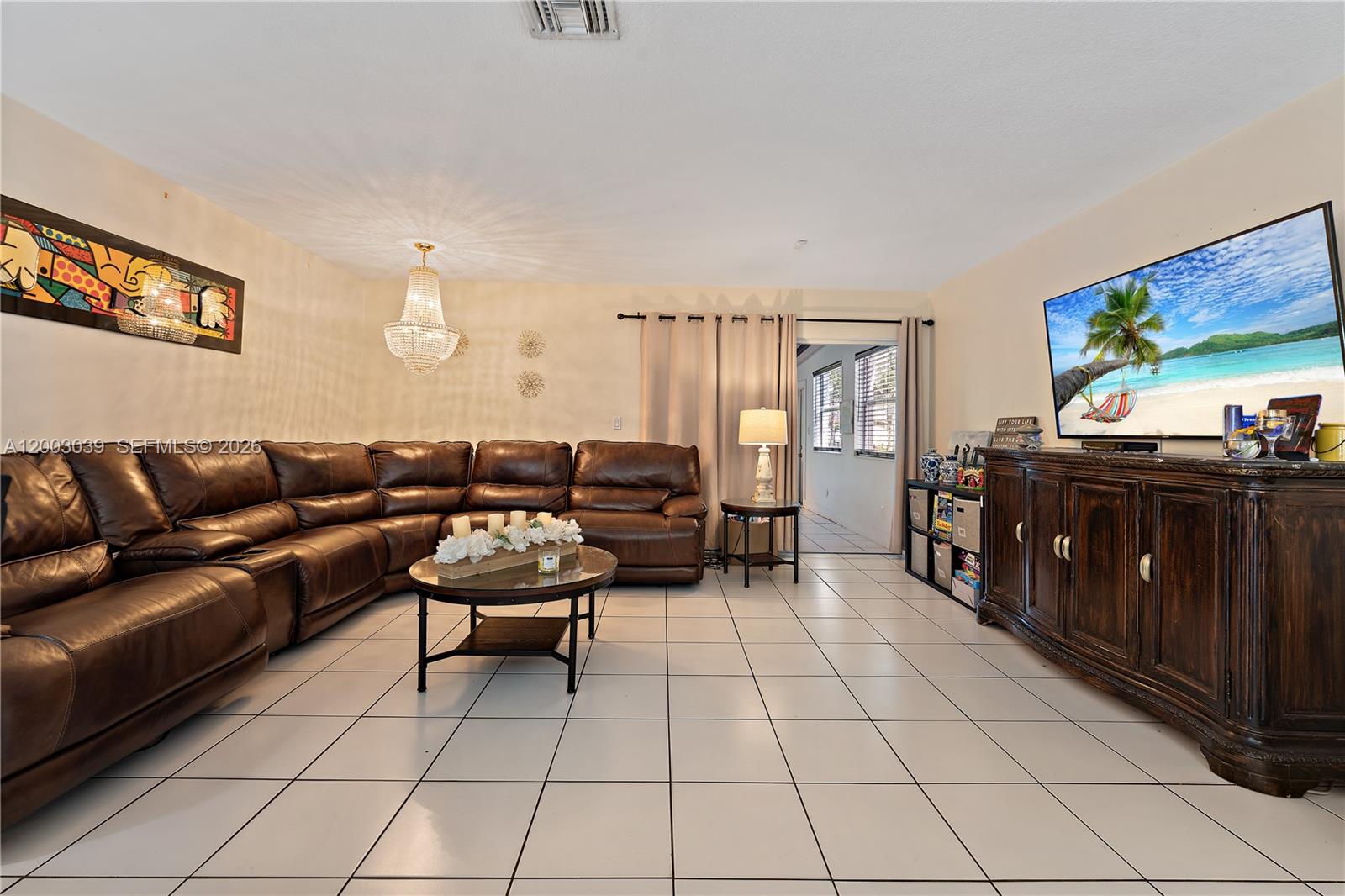 3921 Southwest 124th Court Miami, FL 33175 - Photo 10 of 22 a living room with furniture and a flat screen tv