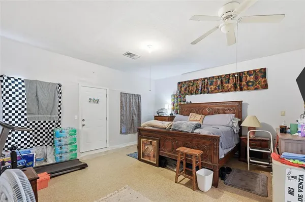 a bedroom with a bed and furniture