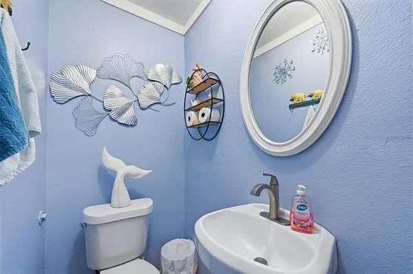 a bathroom with a toilet and a sink
