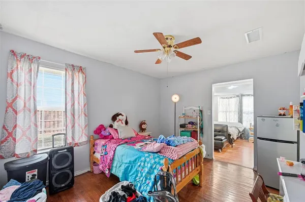 a bedroom with furniture and a window