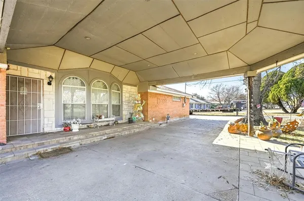 a room with gym equipment and large windows