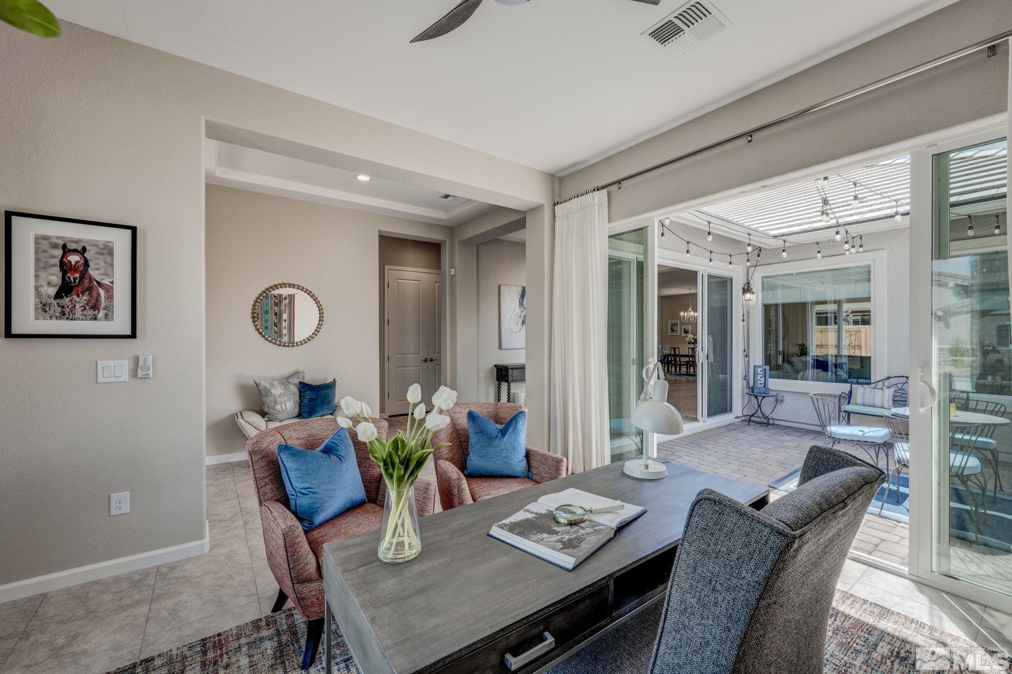 9665 Thesolious Lane Reno, NV 89521 - Photo 5 of 39 a view of a dining room with furniture window and outside view