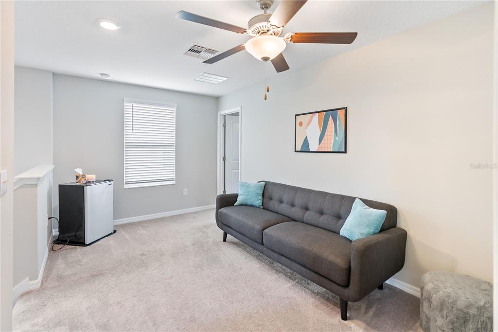 9313 Lemon Drop Loop Ruskin, FL 33573 - Photo 9 of 29 a living room with furniture and window