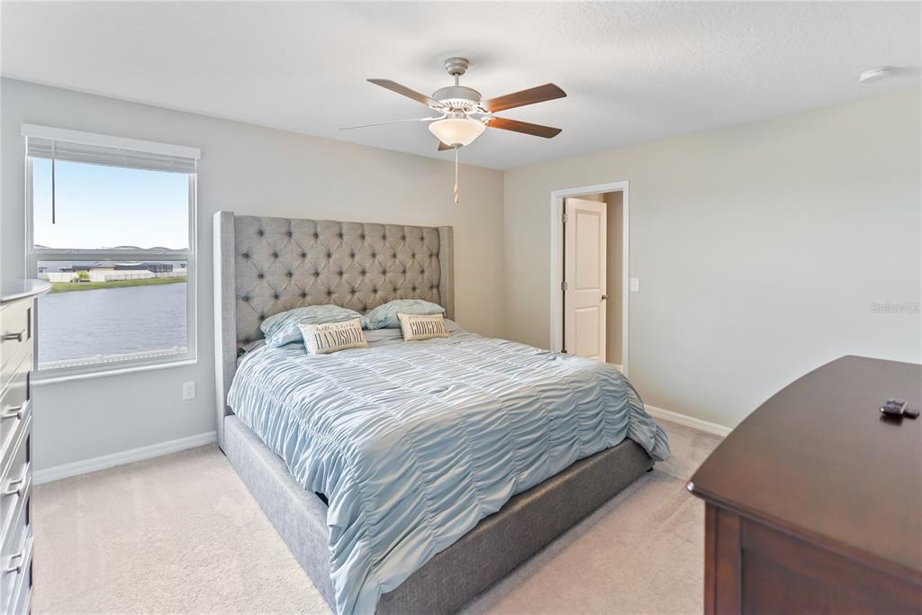 9313 Lemon Drop Loop Ruskin, FL 33573 - Photo 10 of 29 a bedroom with a bed and window