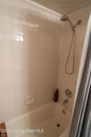 a bathroom with a bath tub