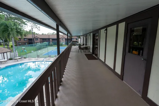 a view of swimming pool from a balcony